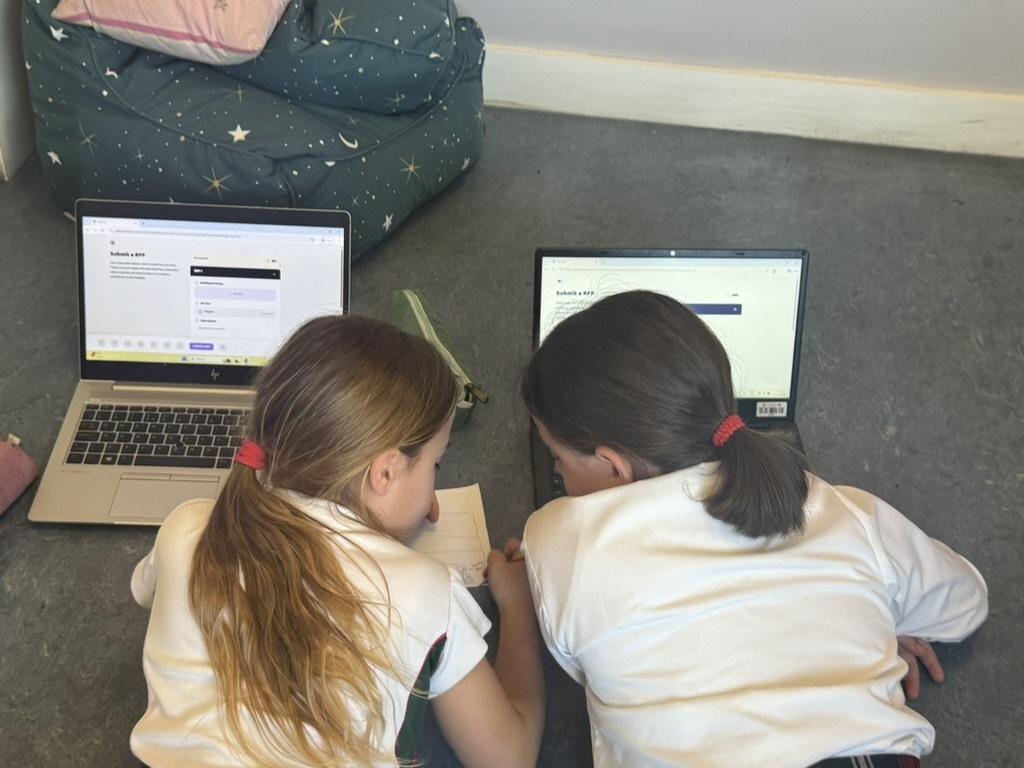 Two pupils working side by side during an EduCity session